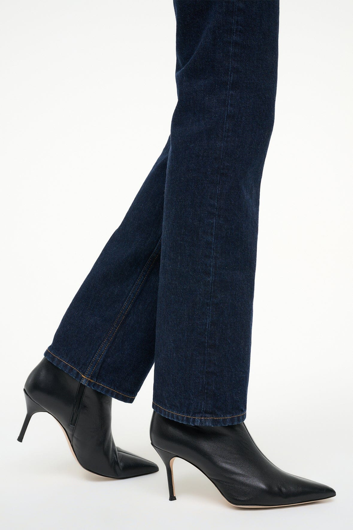 Black leather ankle boots with pointed toe and slim high heel