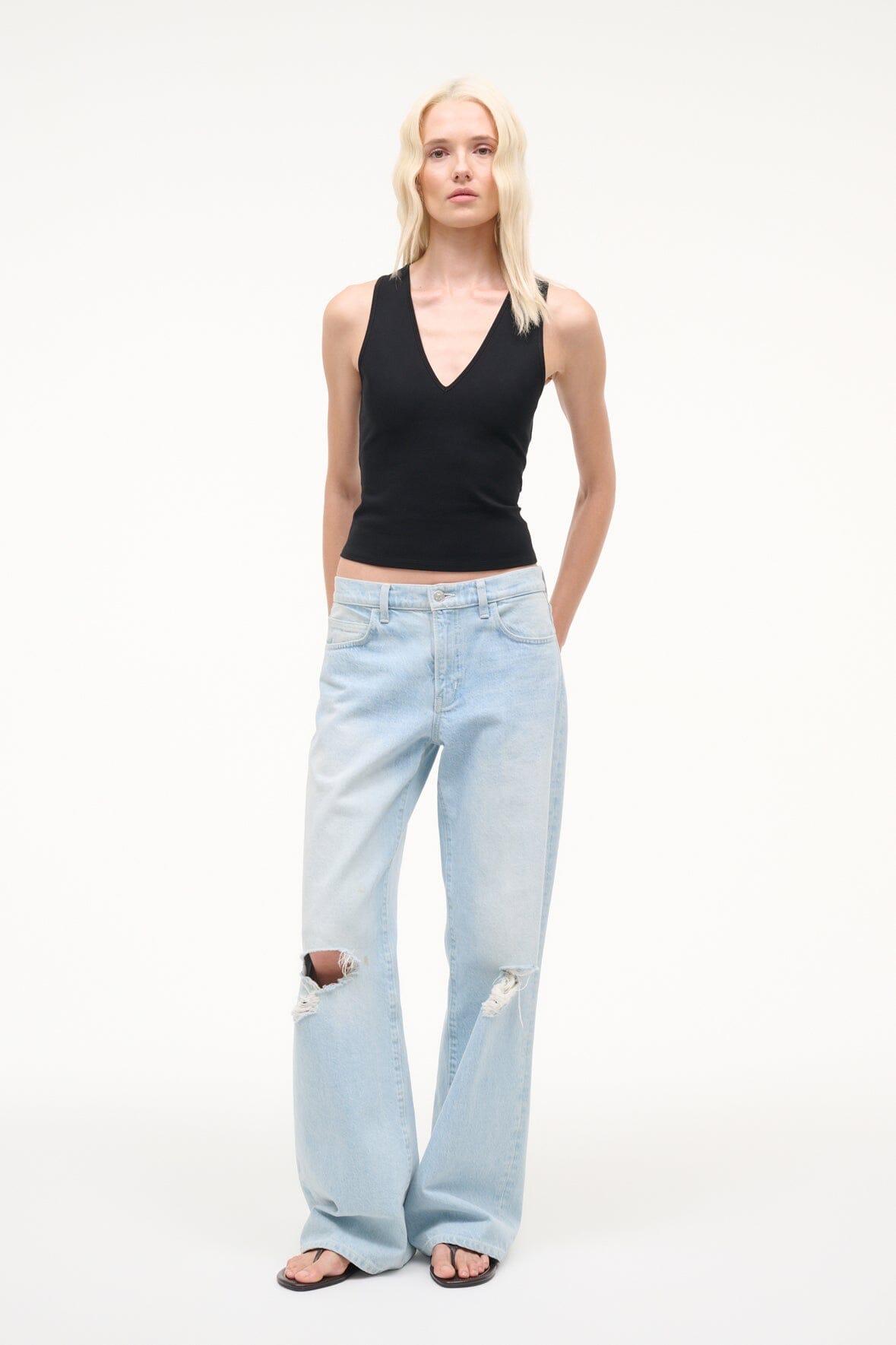 Black sleeveless V-neck tank top with fitted silhouette