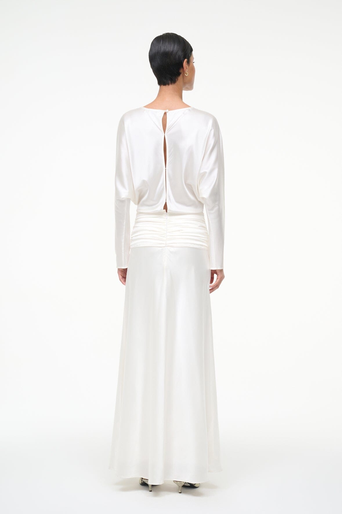 Ivory silk midi dress with open back and ruched hip detail, rear view