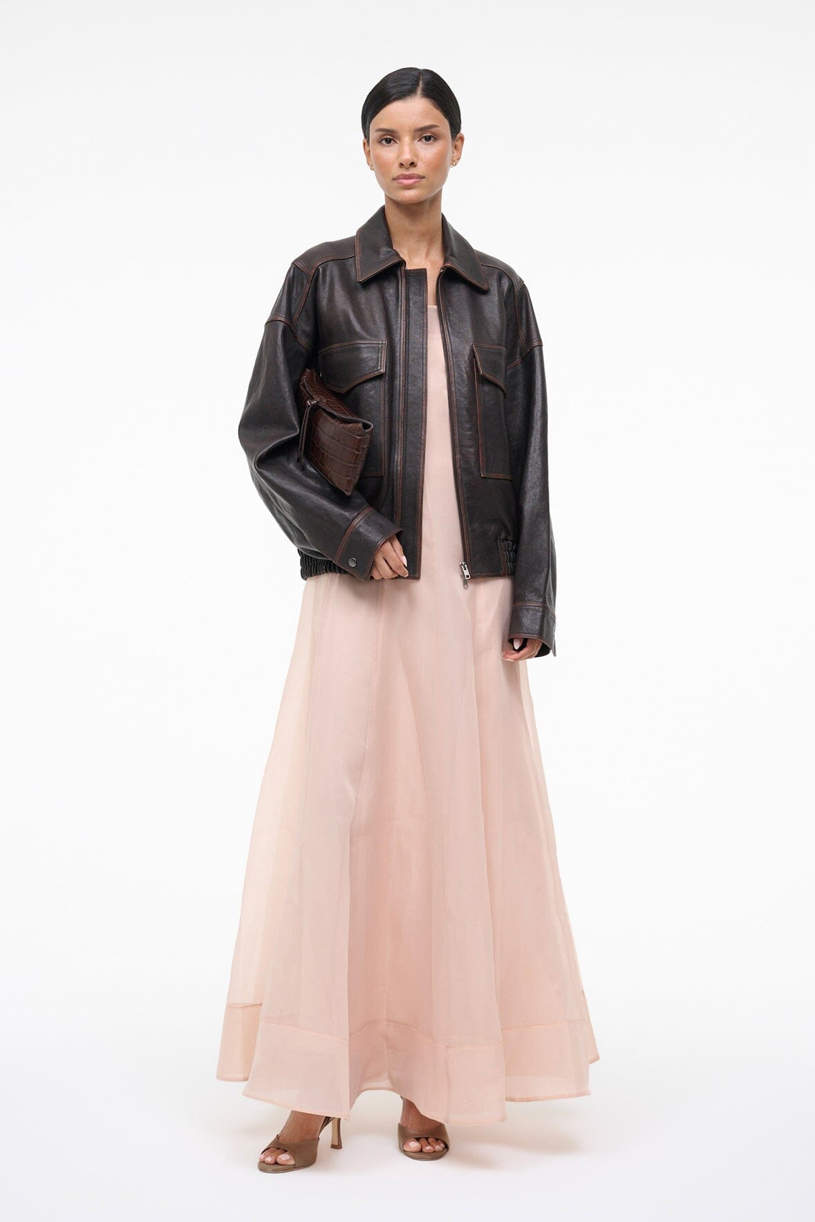 Fawn maxi dress with square neckline under black leather jacket