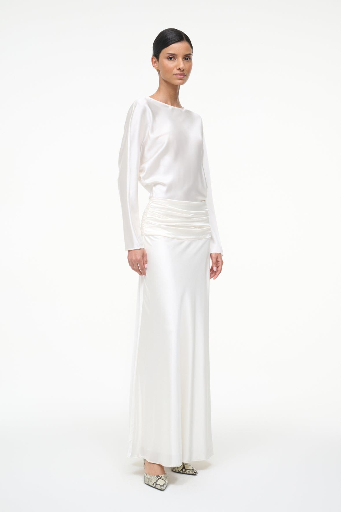 Ivory silk midi dress with long sleeves and ruched waist, side view