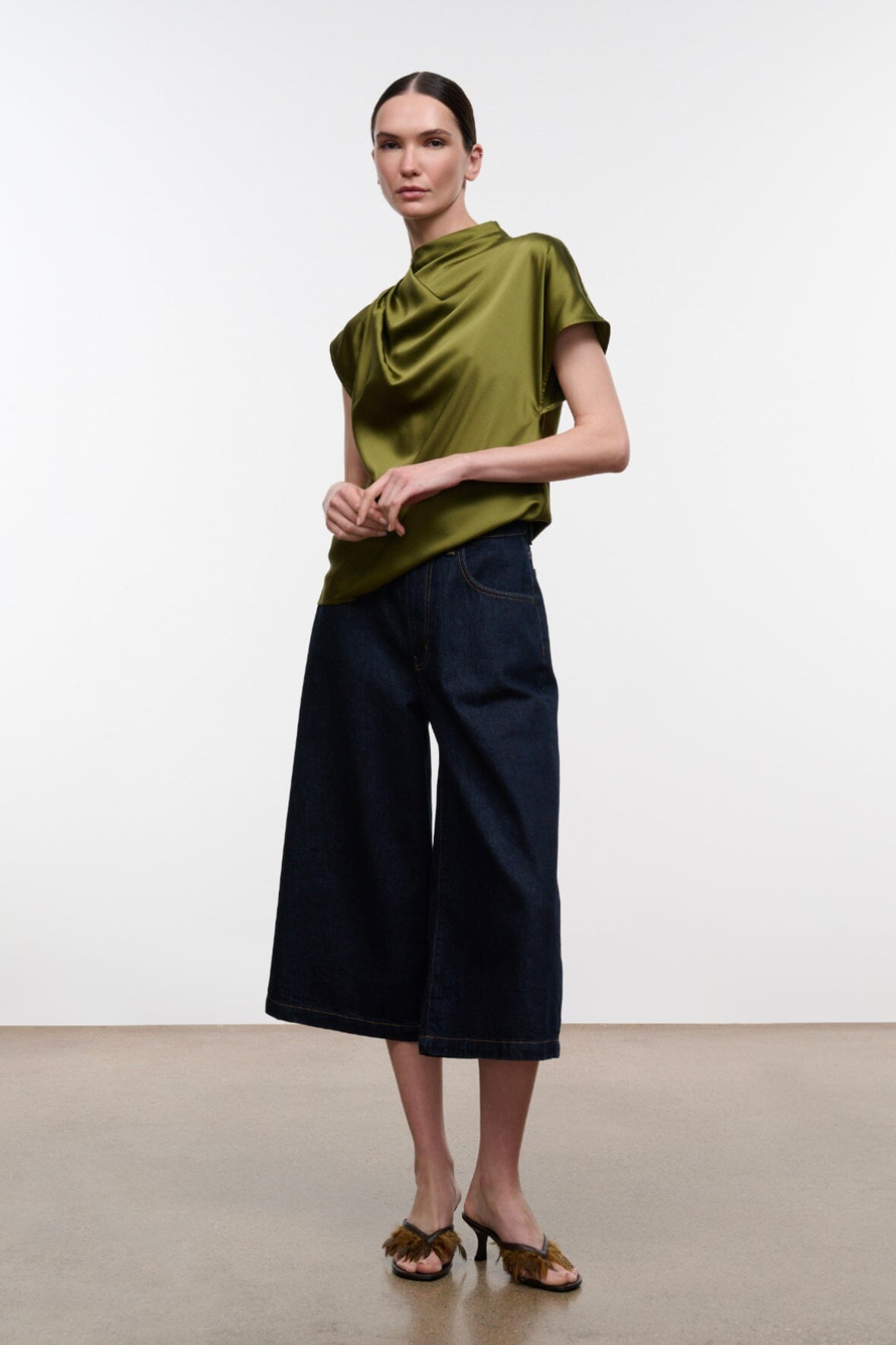 Olive green satin silk mock-neck short-sleeve top with draped detail