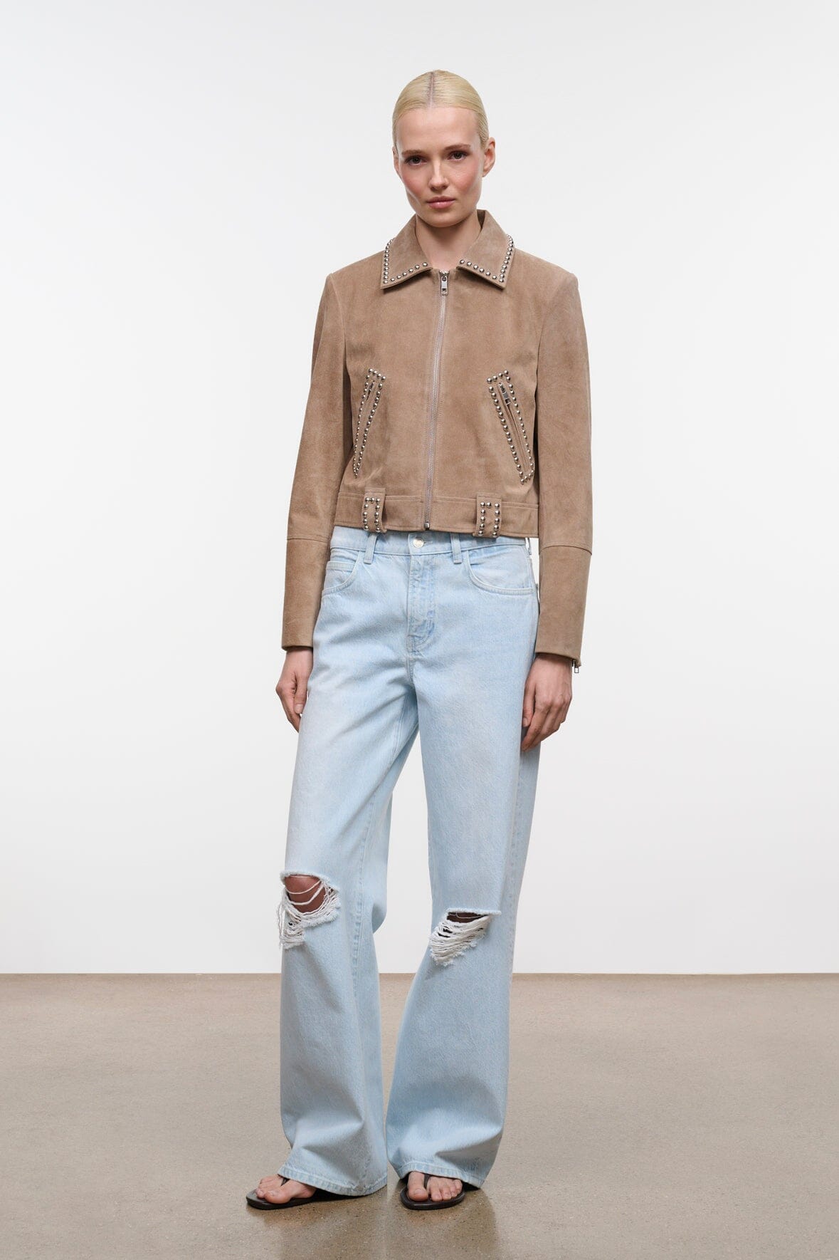 Tan suede zip jacket with studded collar and side flap pockets.