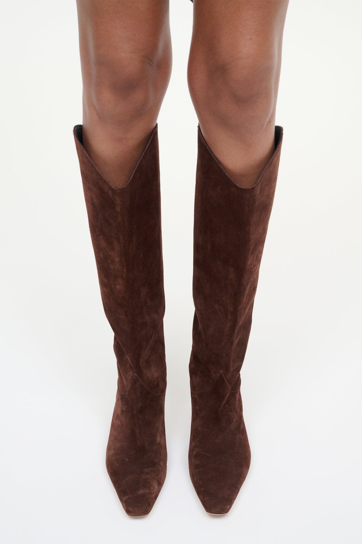 Pair of mahogany suede knee-high boots with pointed toe