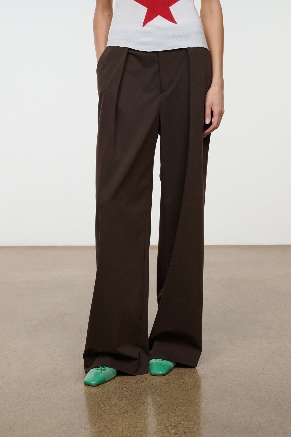 Dark brown wide-leg pants with relaxed fit and side pockets