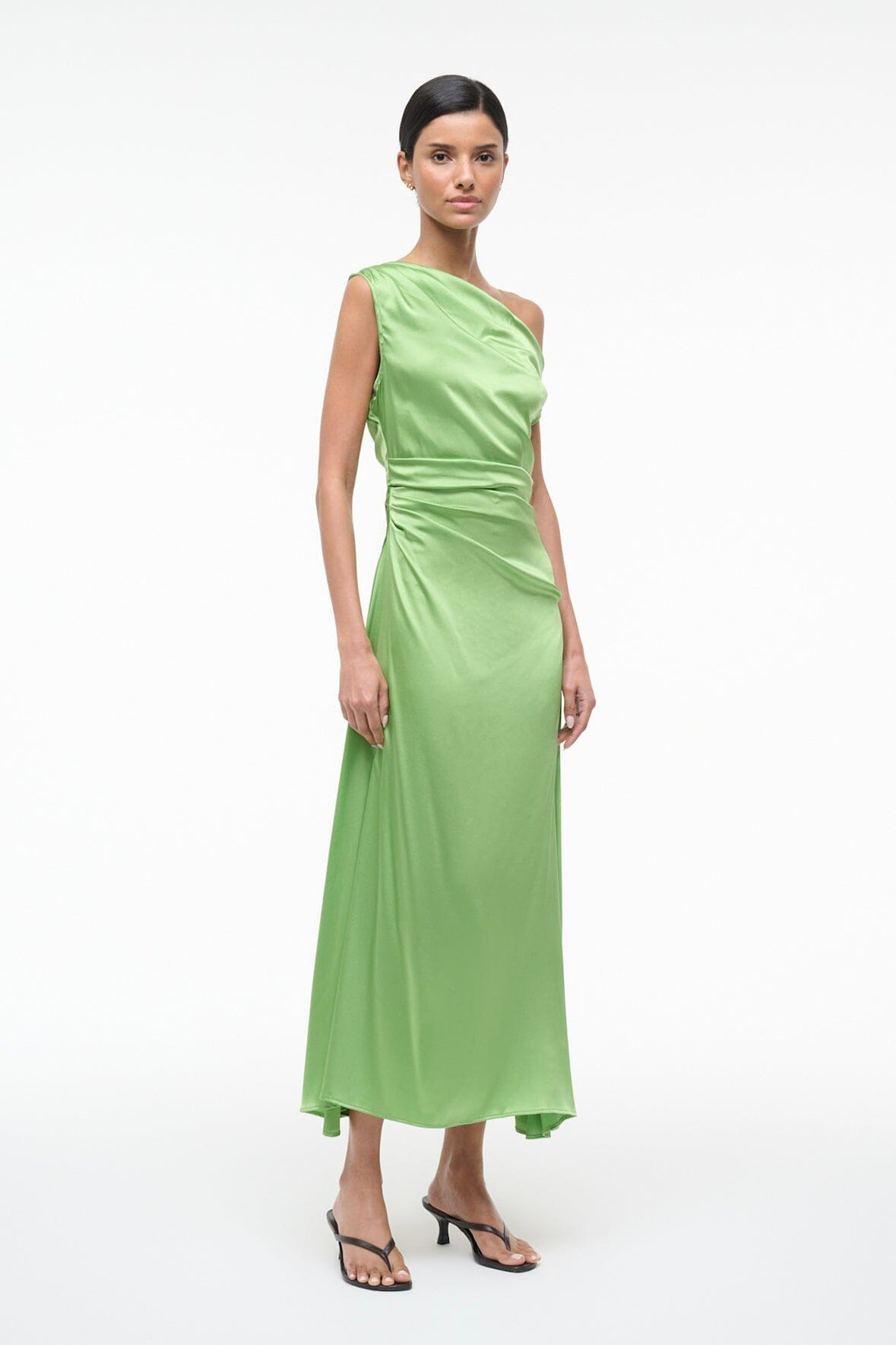 Green sleeveless maxi dress with draped waist and kitten heel sandals