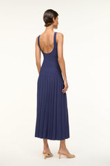 Navy sleeveless square-neck knit dress, back view with pleated skirt