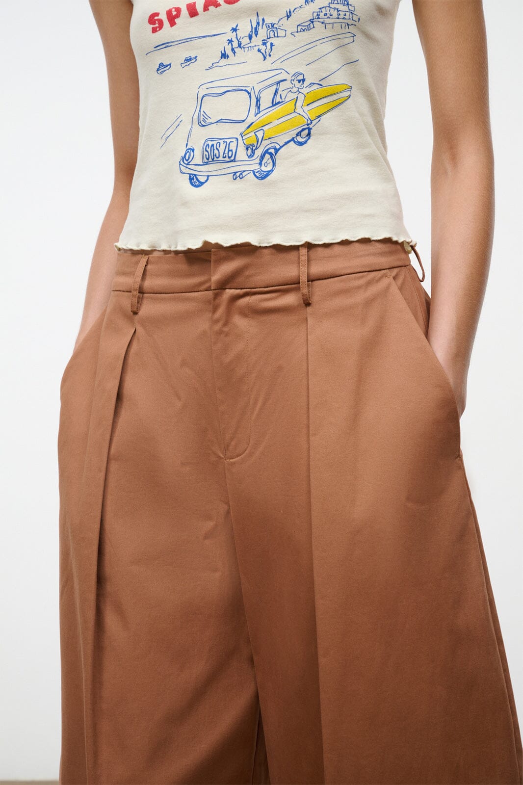 Carob brown high-rise wide-leg pants with pleats and side pockets