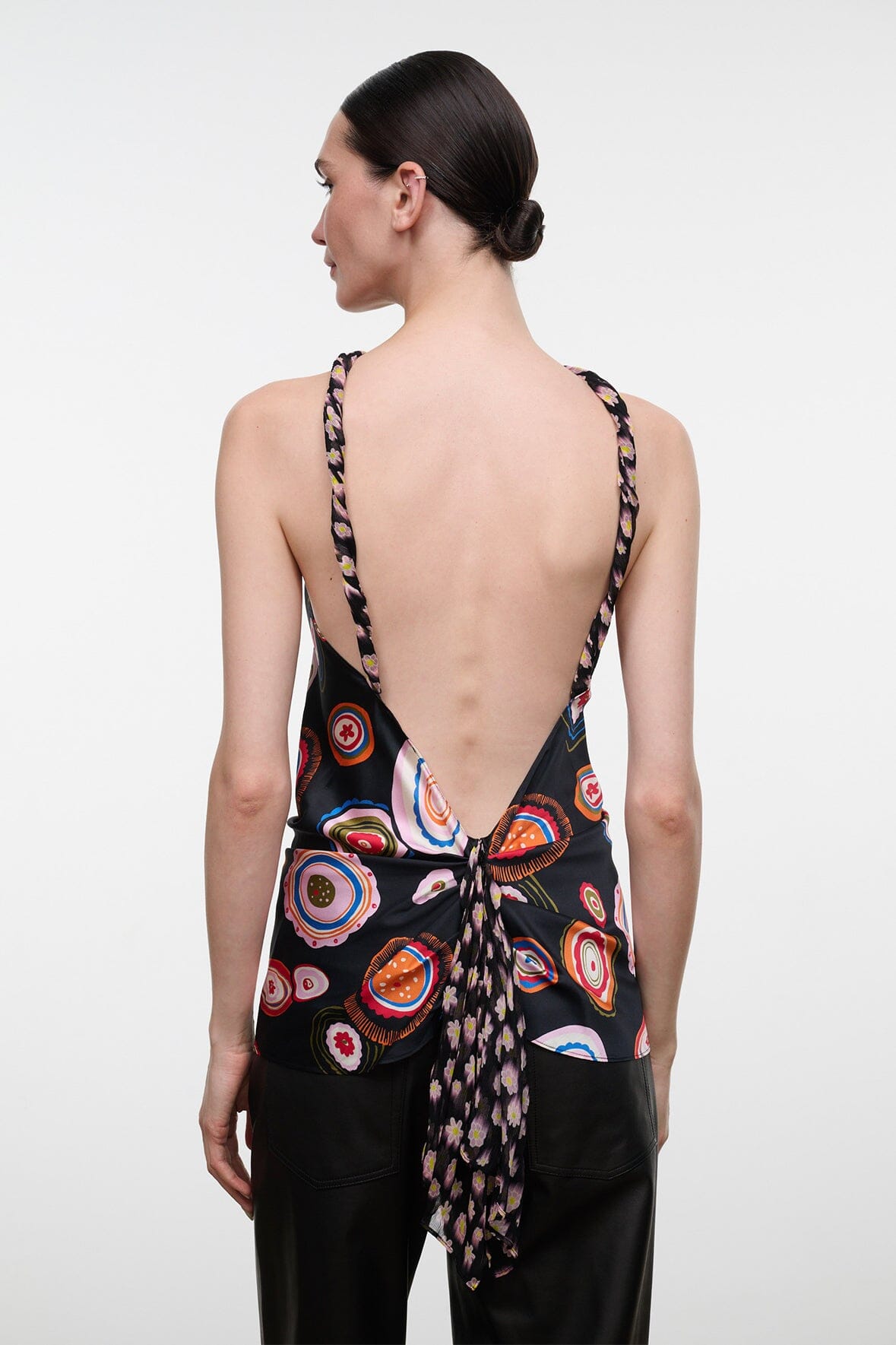Silk halter top with multicolor circular print, open back and crisscross straps