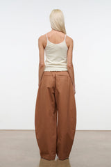 Carob brown high-rise wide-leg pants, back view with center seam