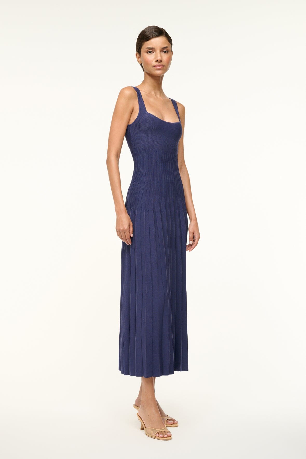 Navy sleeveless knit dress with pleated A-line skirt