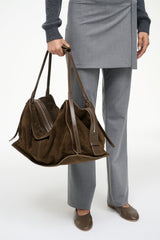 Large truffle suede tote with top handles, side tassels, and zip front pocket