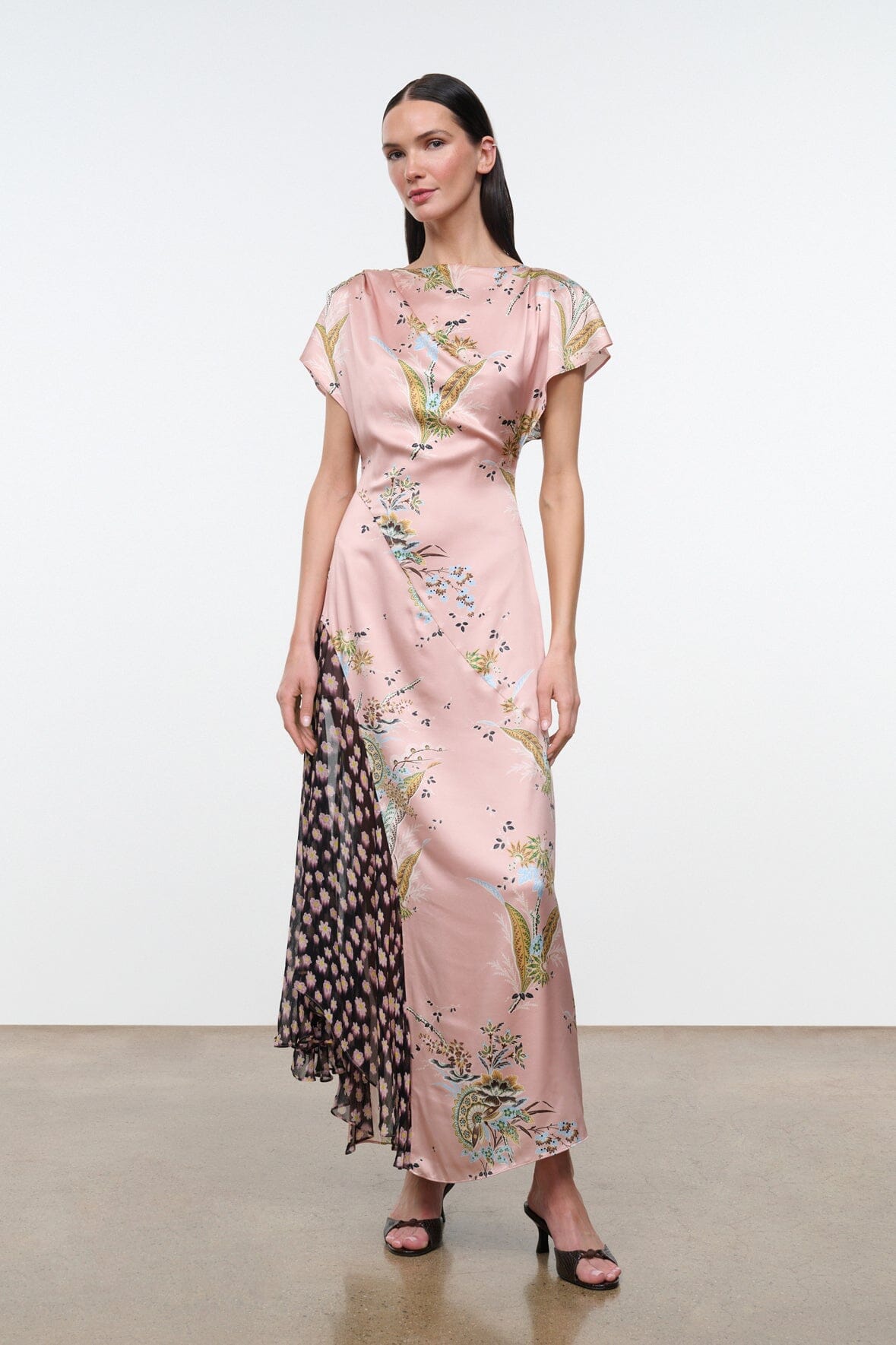 Pink floral long dress with short flutter sleeves and fitted silhouette.