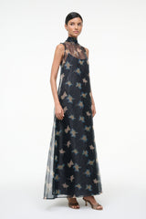 Sleeveless maxi dress with high neckline, sheer dark base and pale botanical bird print