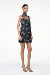 Black shift mini dress with sleeveless high neck and scattered bird pattern