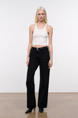 Black croc-texture belt on waistband with silver oval buckle.