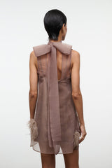 Taupe mini dress back with large bow at collar and feathered trim at hem