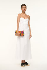 TIMMY shoulder bag in multicolor bead stripes worn by model with a white dress.