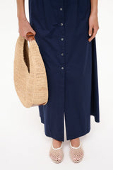 Cream paper netting ballet flats on low tan sole, rounded toe and mesh texture.