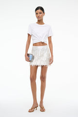 White sequin mini skirt with vertical sparkle texture and fringe hem