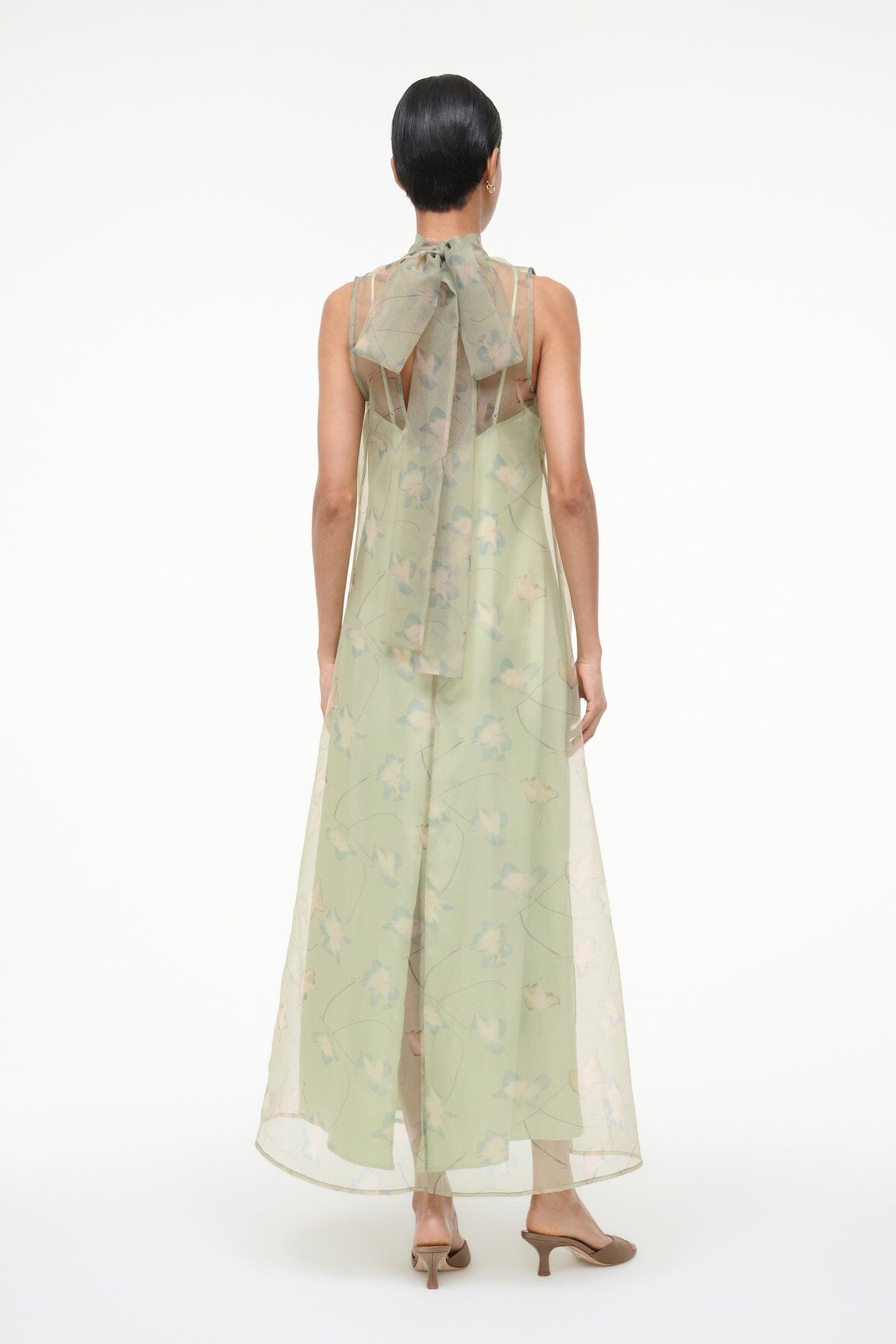Light green sleeveless maxi dress, open back with high neckline and floral print