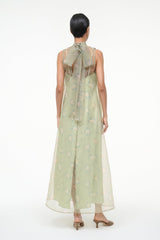 Light green sleeveless maxi dress, open back with high neckline and floral print