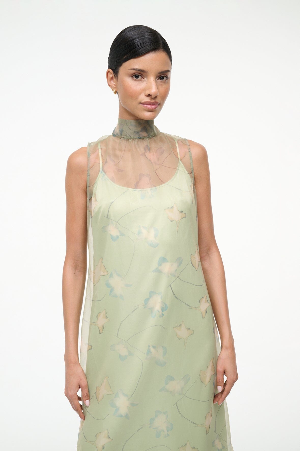 Light green sleeveless dress with high neck and botanical allover print