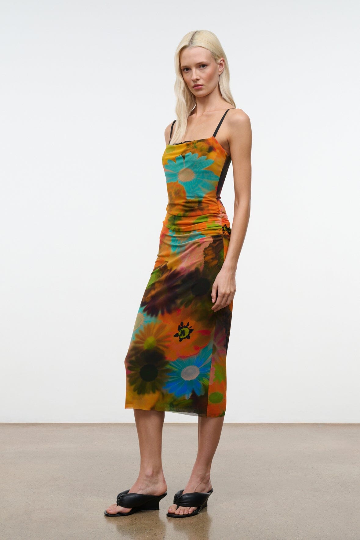Sleeveless fitted midi dress with multicolor floral tie-dye print and spaghetti straps