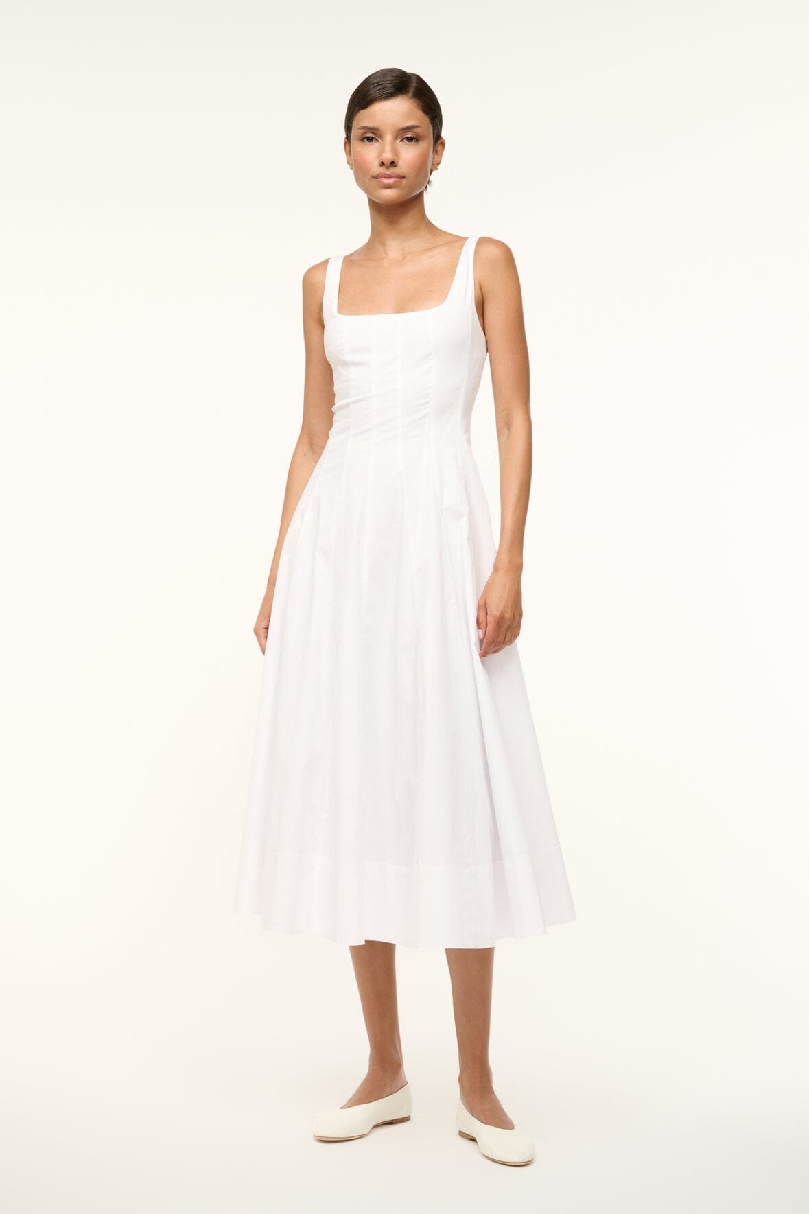 White sleeveless midi dress with flared pleated skirt and square neckline
