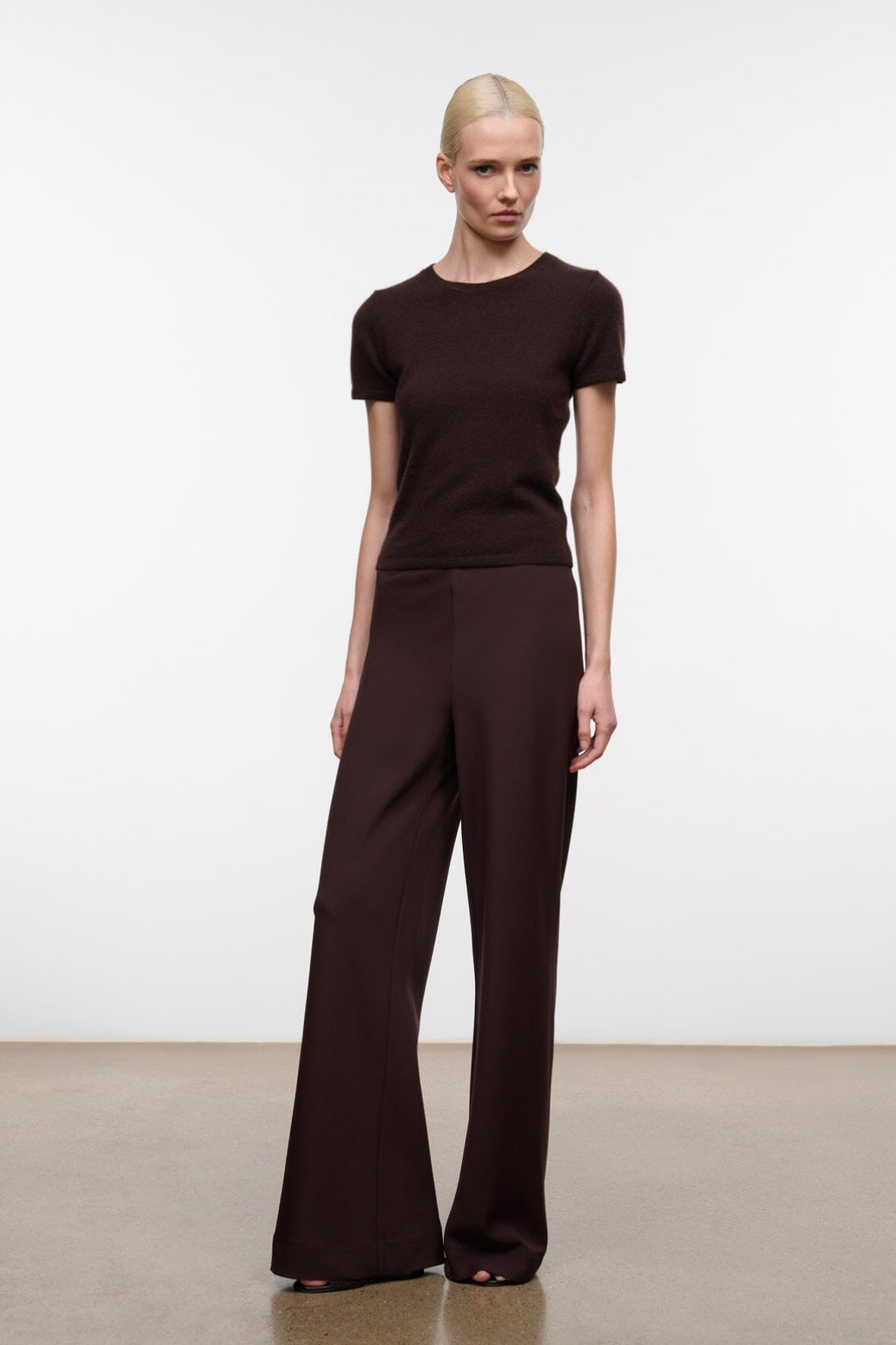 Women's wide-leg pants, dark brown, front view with high-rise waistband and flared hem
