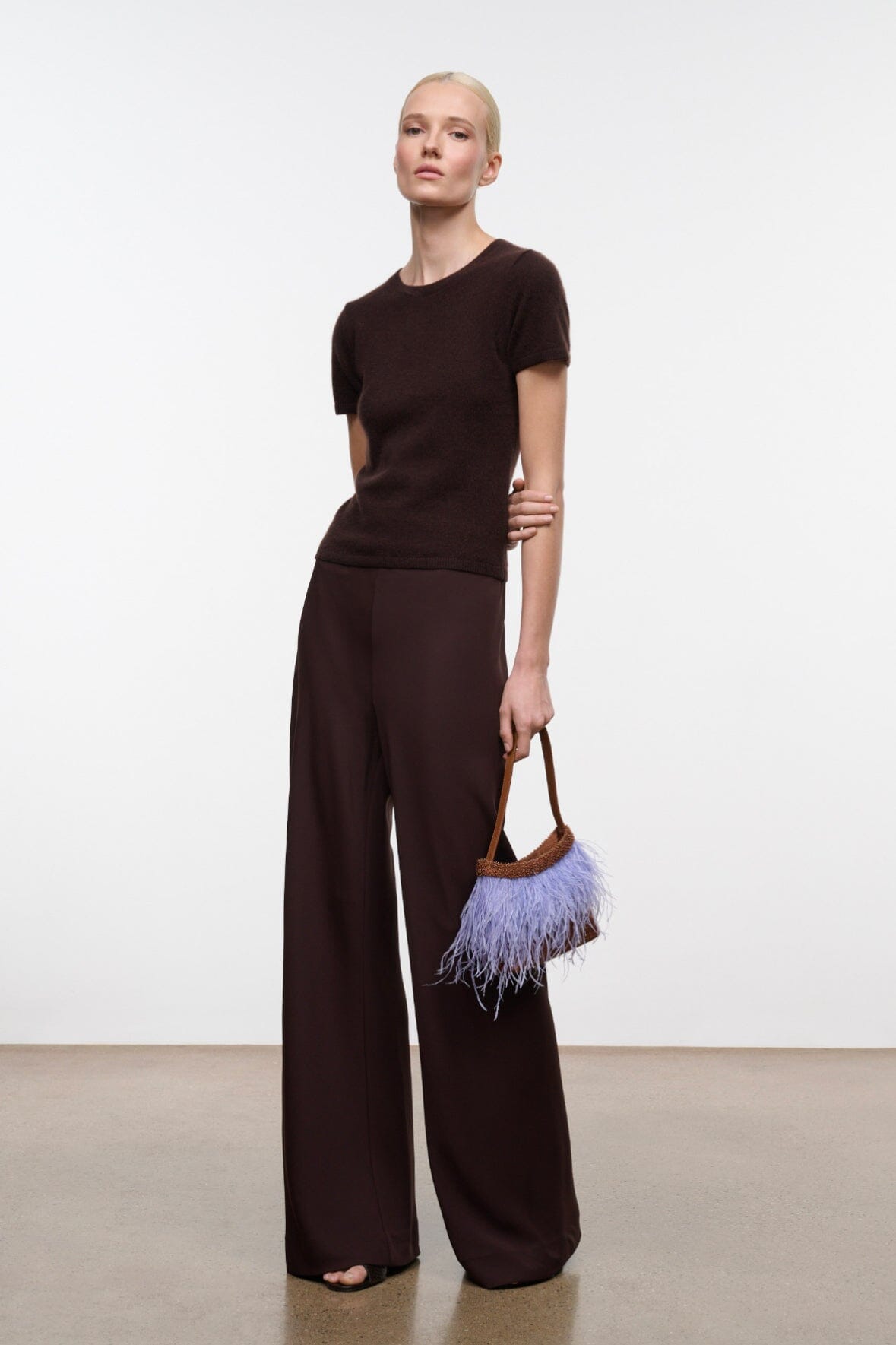 Women's wide-leg pants, dark brown, side view with high-rise fit and wide leg openings