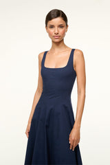 Navy sleeveless square-neck dress with fitted bodice and gathered skirt