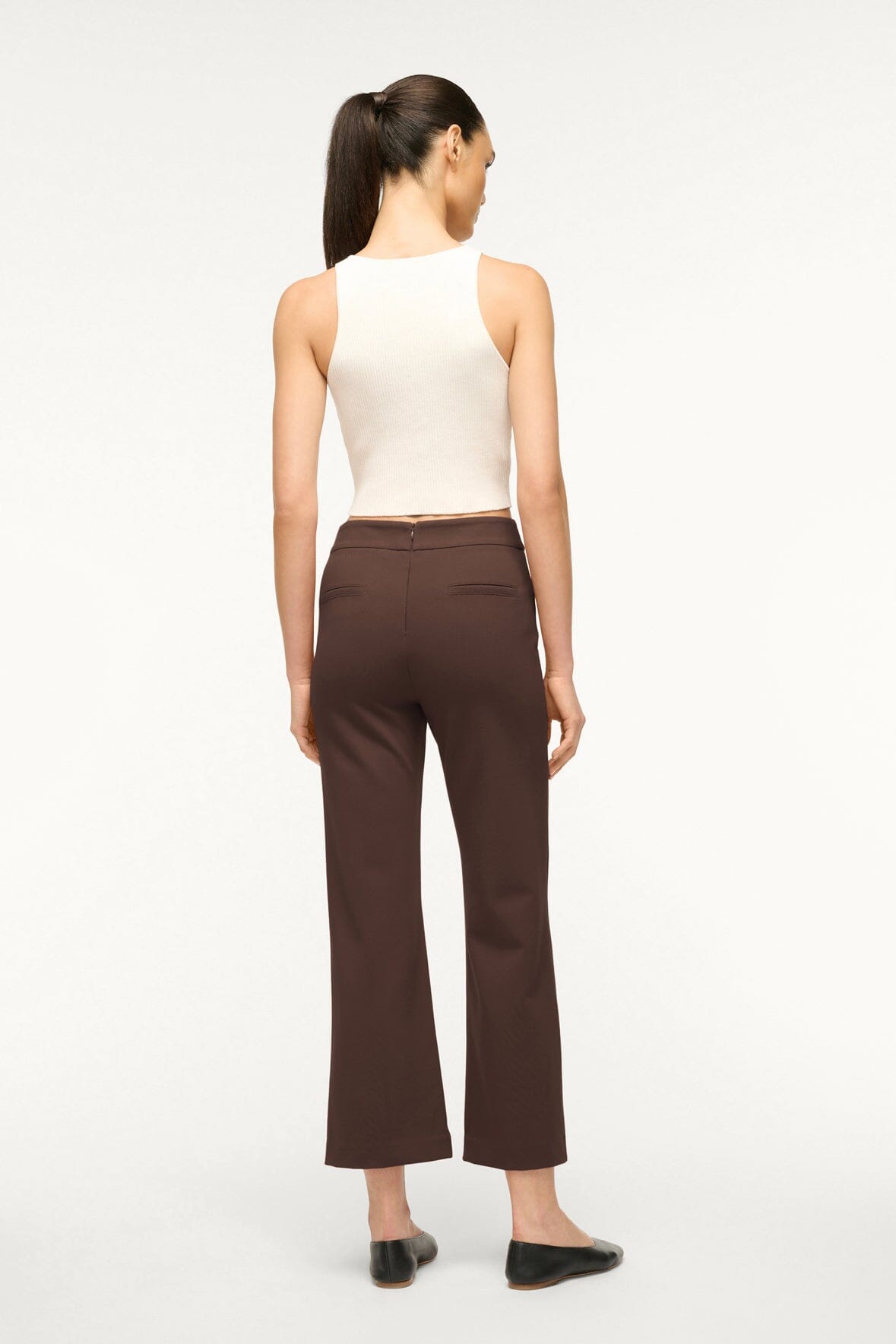 Women's dark chocolate brown pants, wide-leg cut, back view standing.