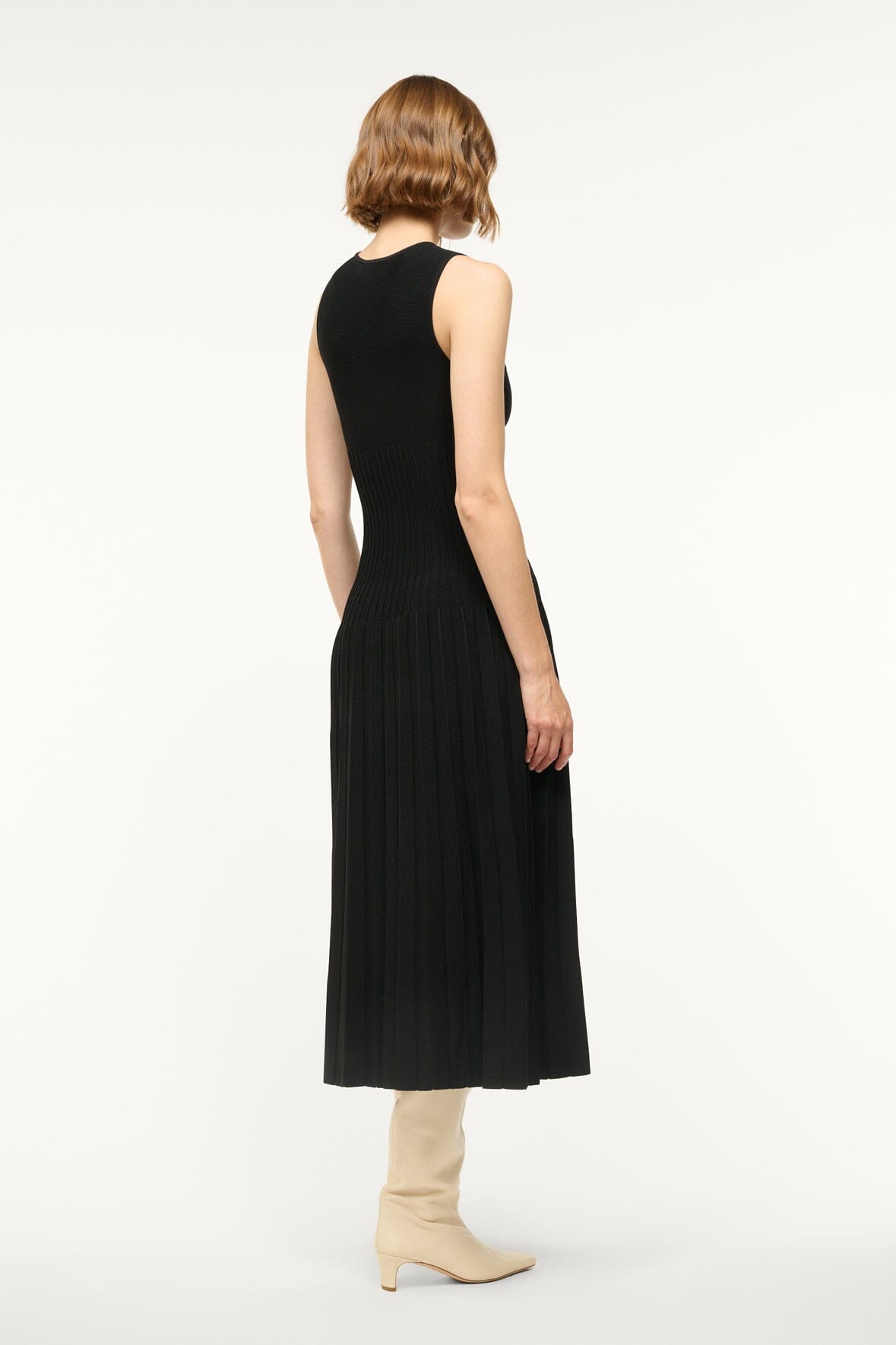 Black sleeveless midi knit dress with crew neck, slim fit and pleated skirt (back)