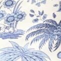 Blue-and-white toile fabric close-up with leafy botanical motif
