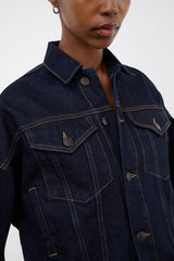 Indigo denim jacket collar and chest with contrast topstitching and buttoned flap pockets