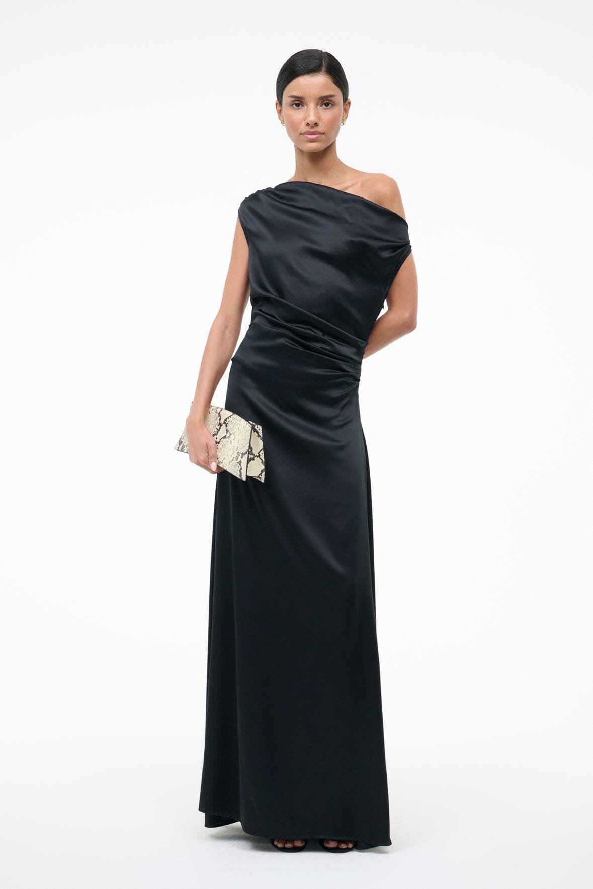 Black one-shoulder silk maxi dress with diagonal drape and ruched waist