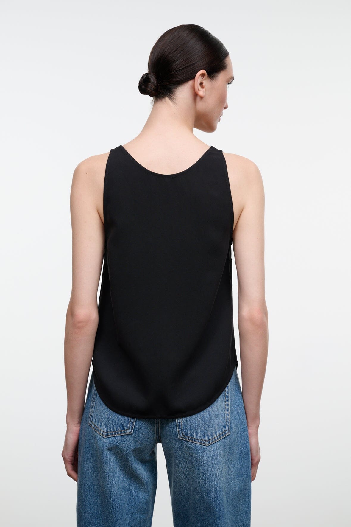 Black sleeveless tank top, racerback style, draped hem