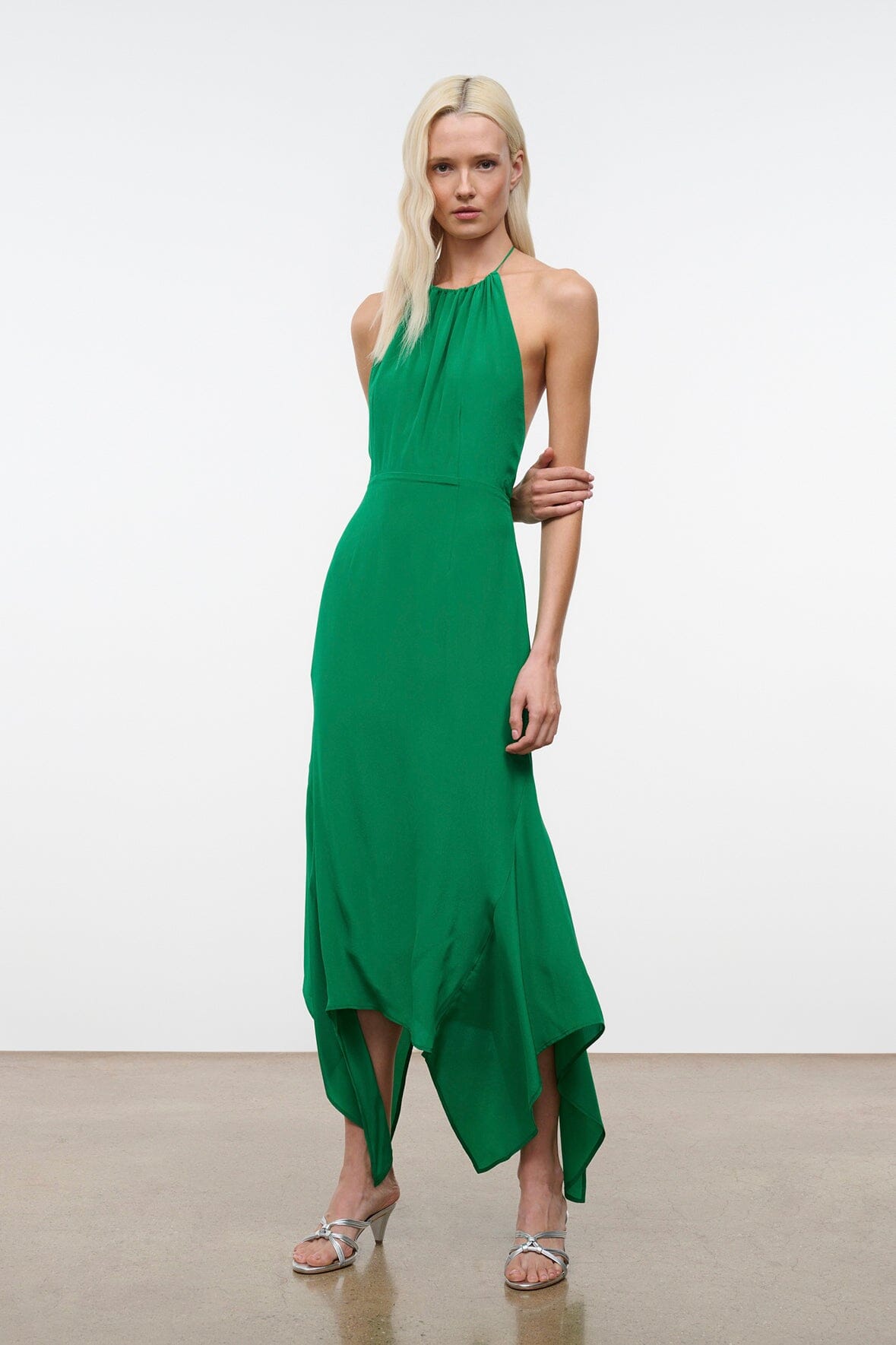 Bianca silk dress in Kelly green, halter neck, sleeveless, asymmetrical handkerchief hem