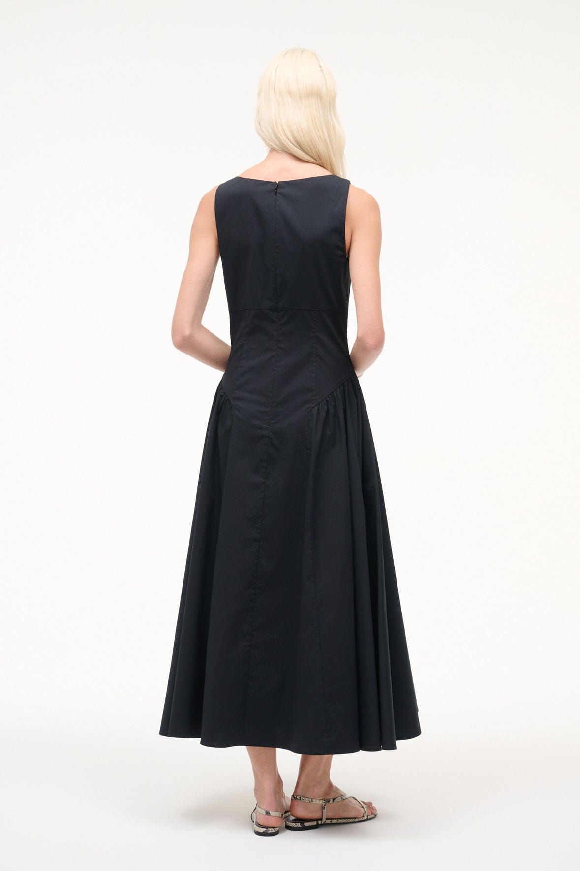 Back view of sleeveless black midi dress with gathered waist and flared skirt
