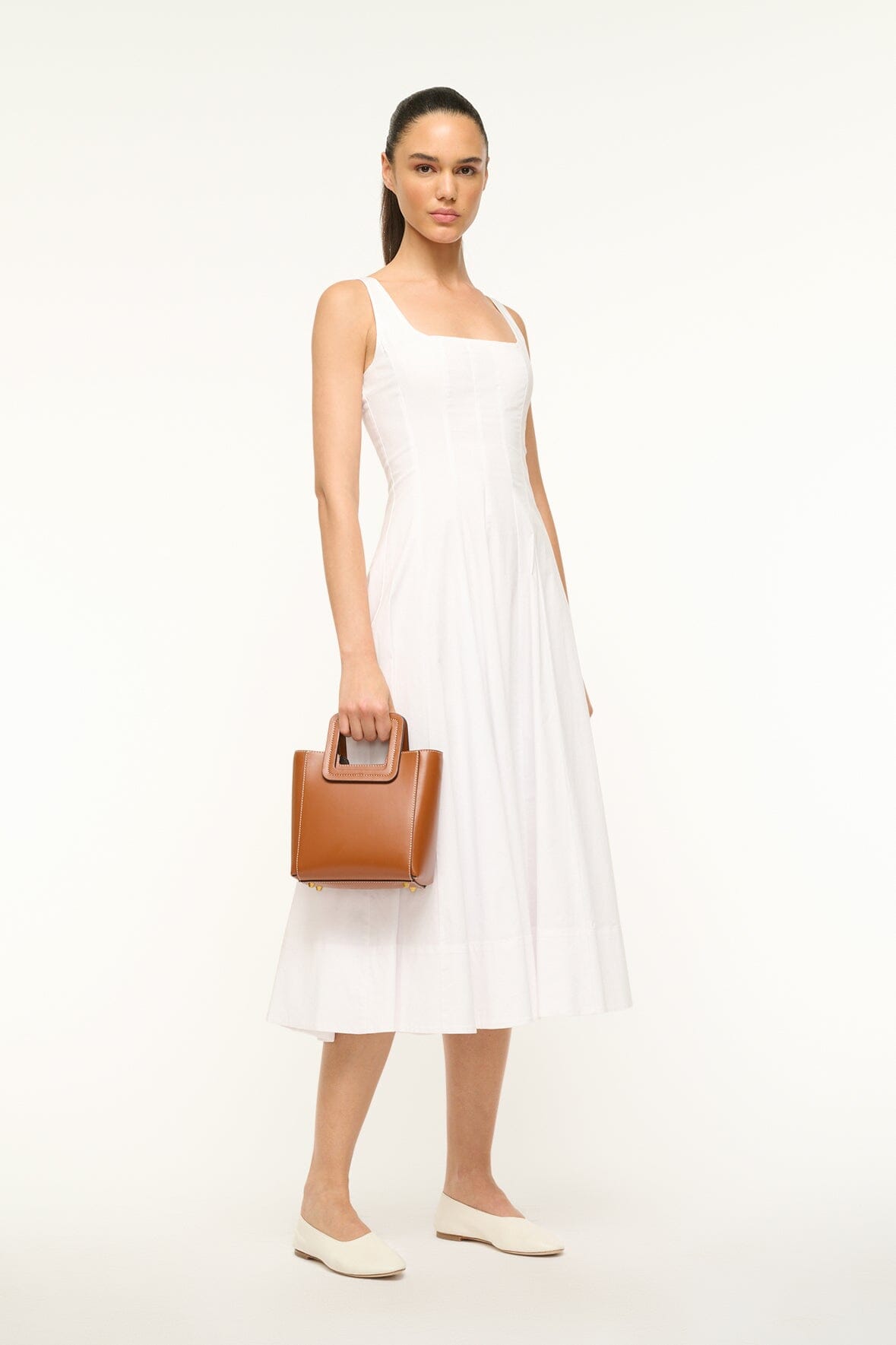 Saddle brown mini leather top-handle bag with square clasp front