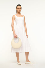 Cream crescent moon bag carried over the shoulder