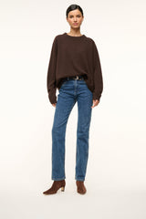 Mahogany suede ankle boot worn with blue jeans; side gore and block heel