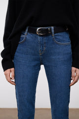 MOON METAL keeper belt worn with blue jeans, black strap and silver buckle