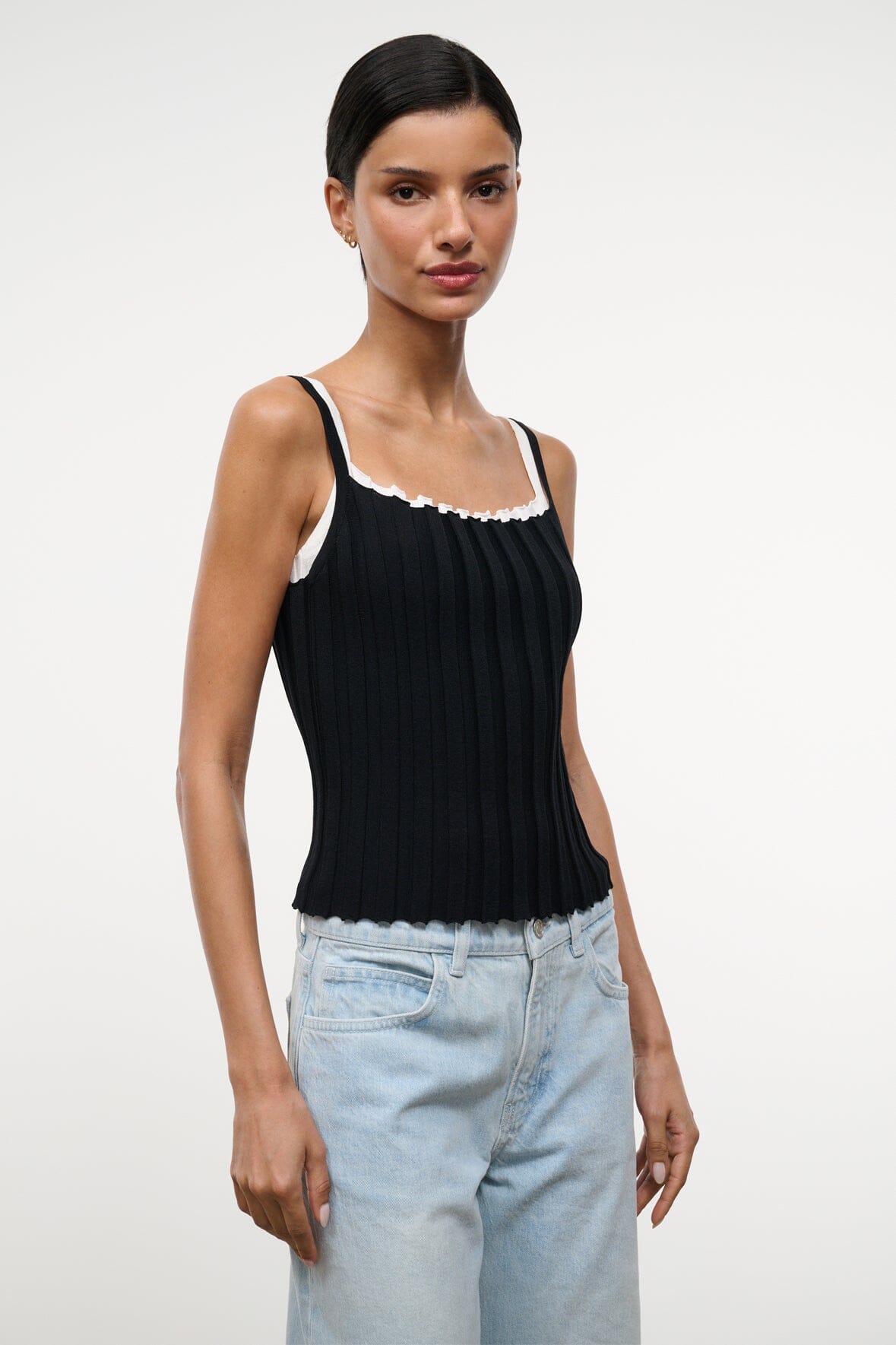 Black sleeveless tank top with white lace-trim scoop neckline