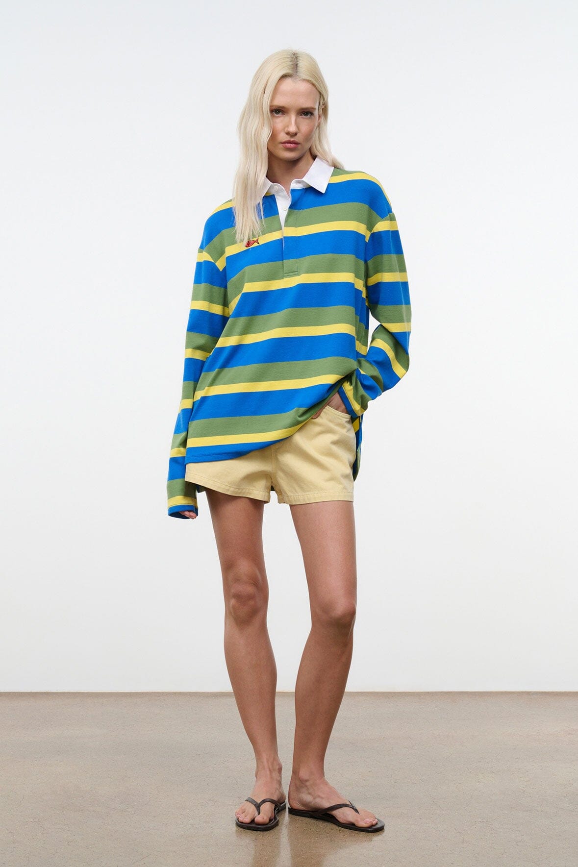 Striped button-up shirt with white collar, long sleeves, blue green yellow stripes