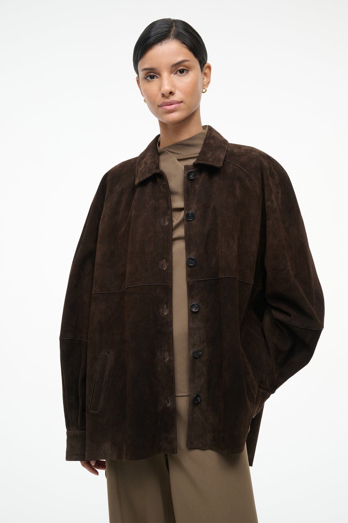 Dark brown suede shirt, button-up placket, pointed collar, flap pockets, long sleeves.