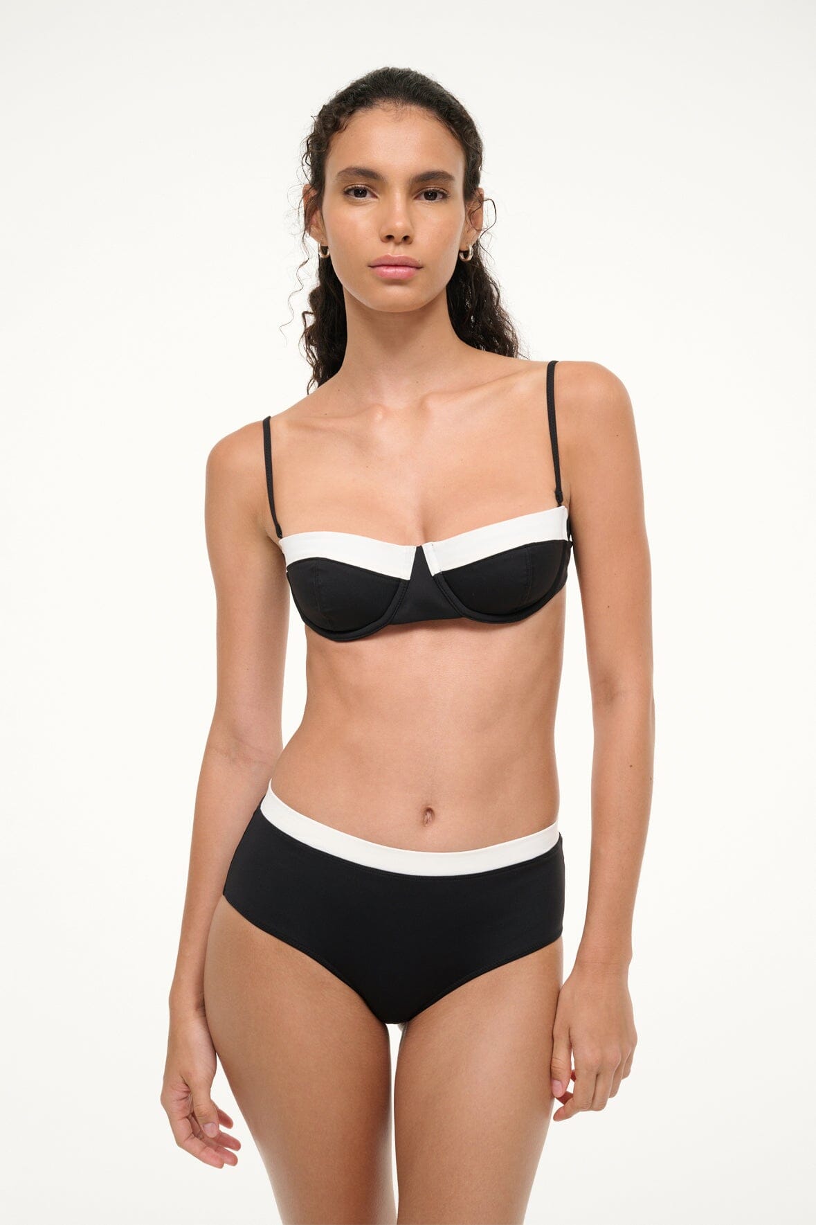 Black balconette bikini top with white band and thin straps on model