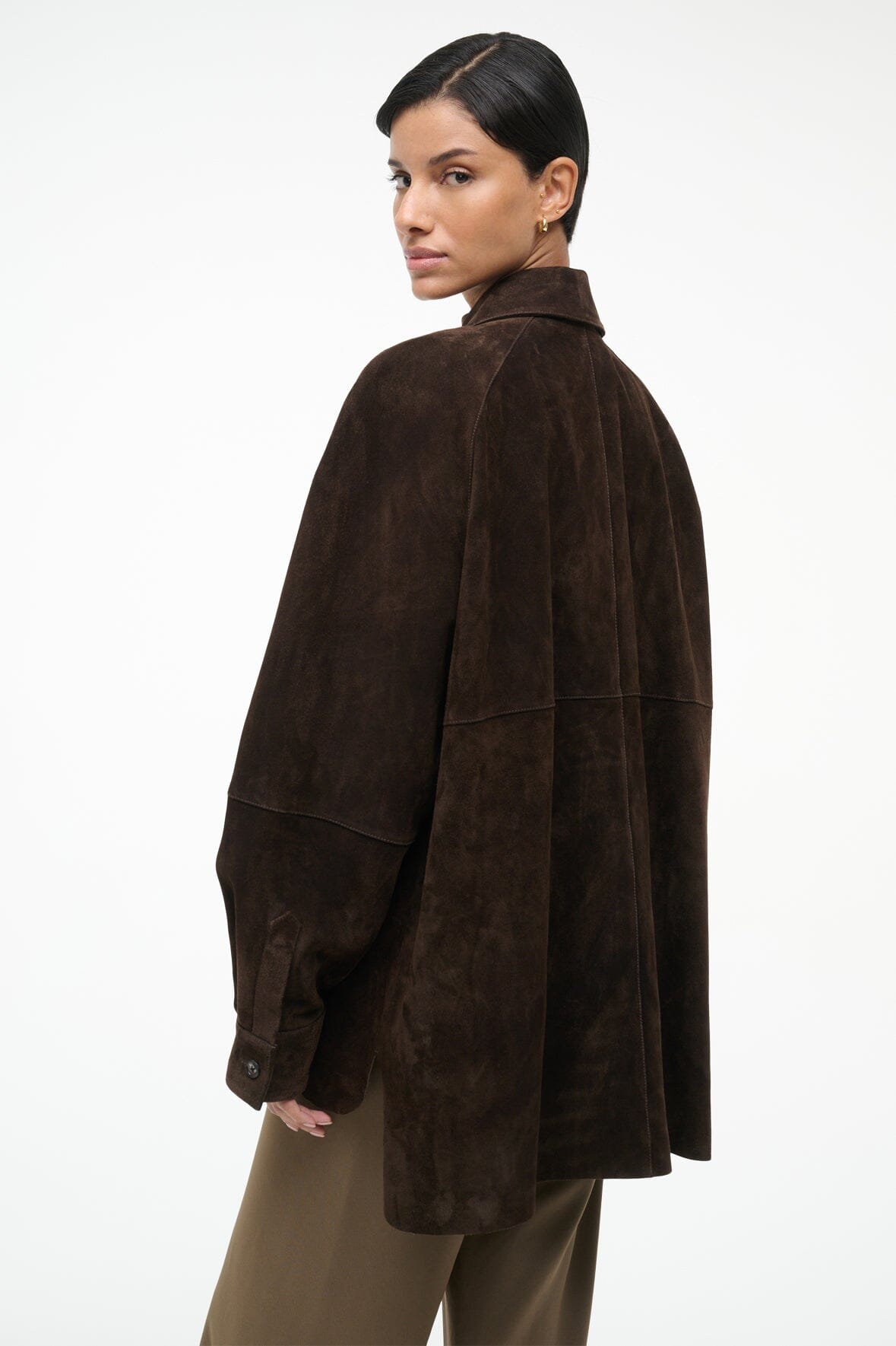 Dark brown suede shirt, button-up front, pointed collar, long sleeves, side profile view.
