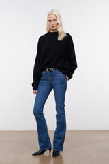 Women's stone blue stretch flare jeans with mid-rise fit and flared leg opening
